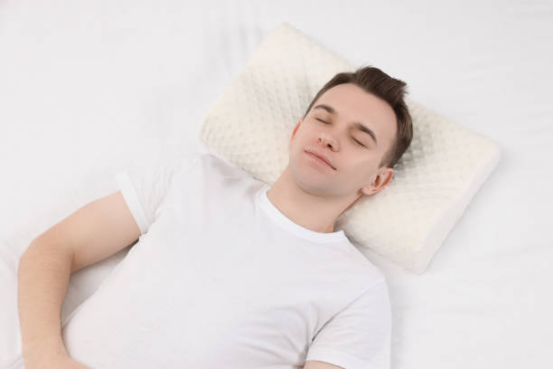 Close-up of Memory Foam Pillow adjusting to the shape of the neck and shoulders to improve sleep.
