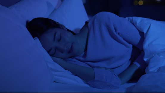 Person sleeping with a Memory Foam Pillow, maintaining proper alignment