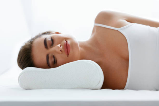 Upper back and shoulder relaxation using a memory foam pillow